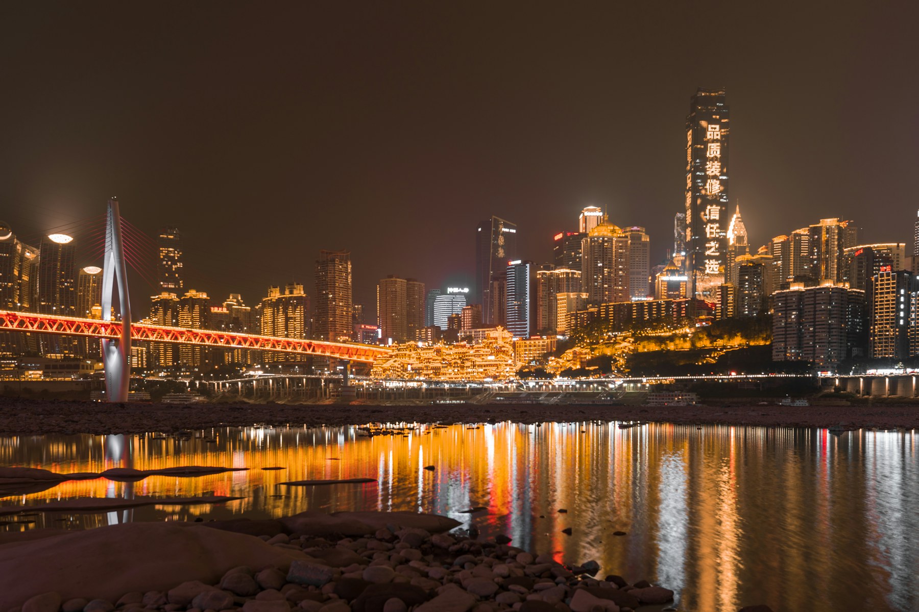 Chongqing riverfront and Hongya Cave illuminated after dark