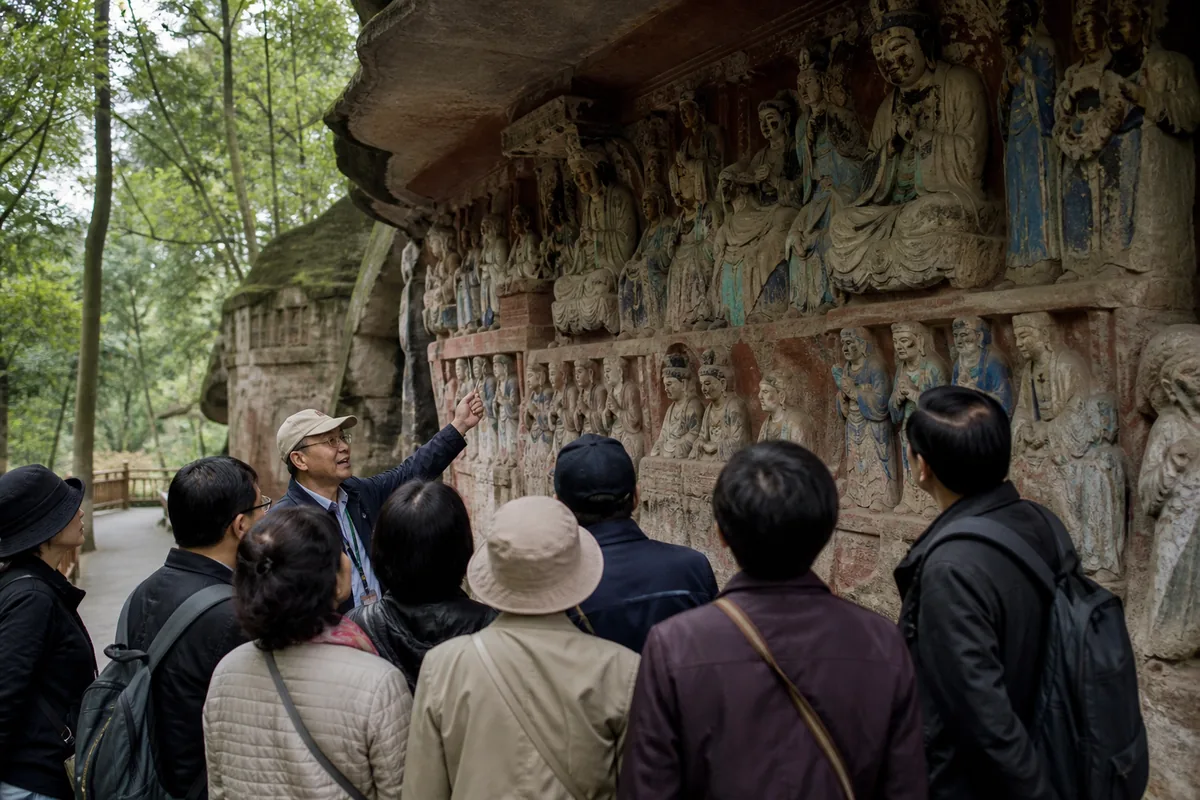 Illustrative heritage guide explaining the Dazu Rock Carvings to a small group