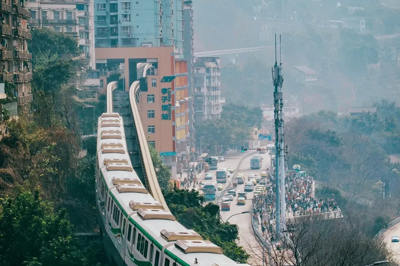Chongqing Line 2 monorail emerging from the Liziba building on a hillside